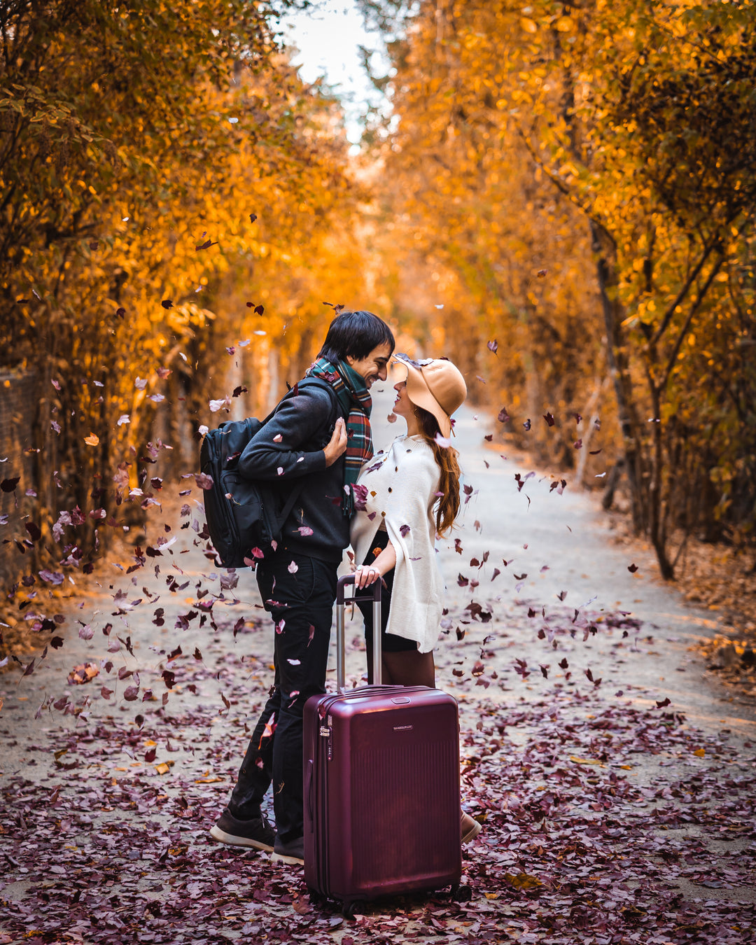 Couple in fall with briggs and riley purple hardside luggage bought from shop-in-shop San Francisco