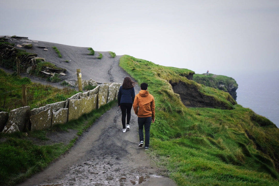 Two people walking path in Ireland