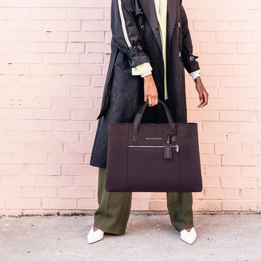 woman holding purple carry on briggs and riley tote bag palo alto ca