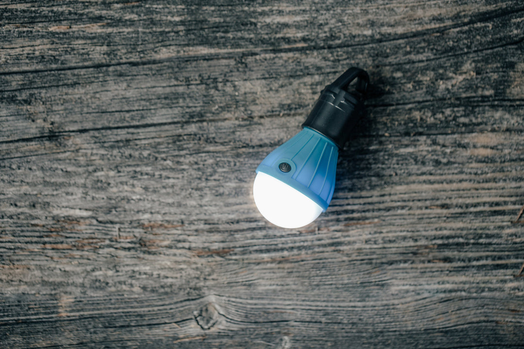 travel flashlight on wood table