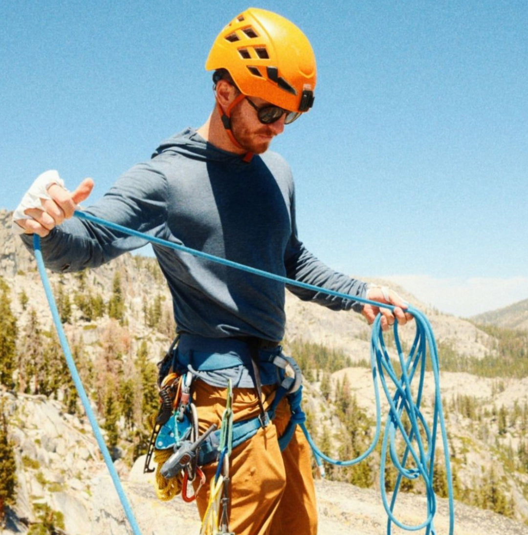 man rock climbing wearing royal robbins clothing