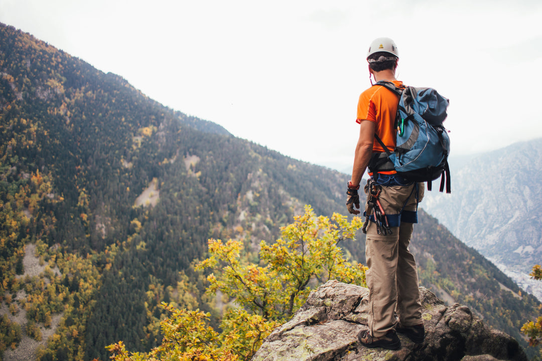 man wearing hiking pants on mountain