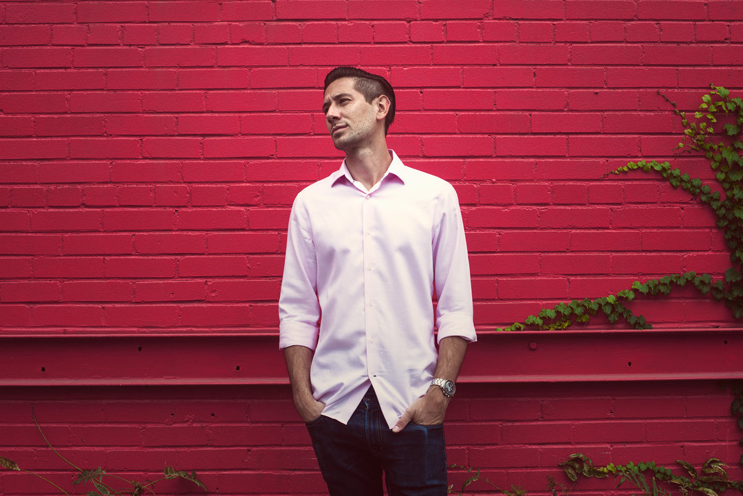 man wearing pink wrinkle free travel shirt