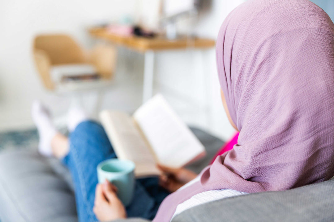 Woman reading Michelin Star Guidebook to prepare for trip