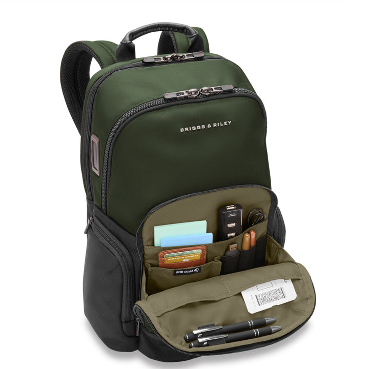 Medium backpack has front zip pocket to organize pens, wallet, USB, chargers adn notebook