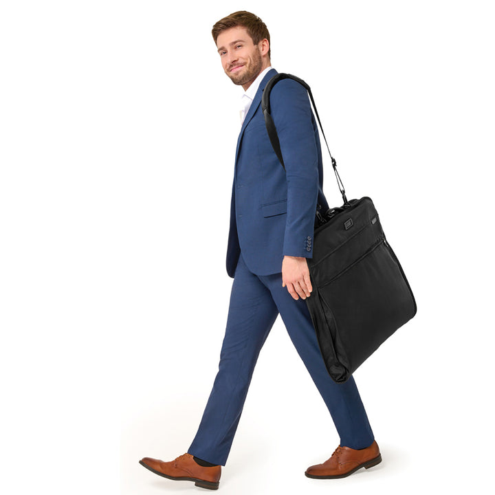 Six foot tall model wears Briggs & Riley Baseline Classic Garment Bag by shoulder strap