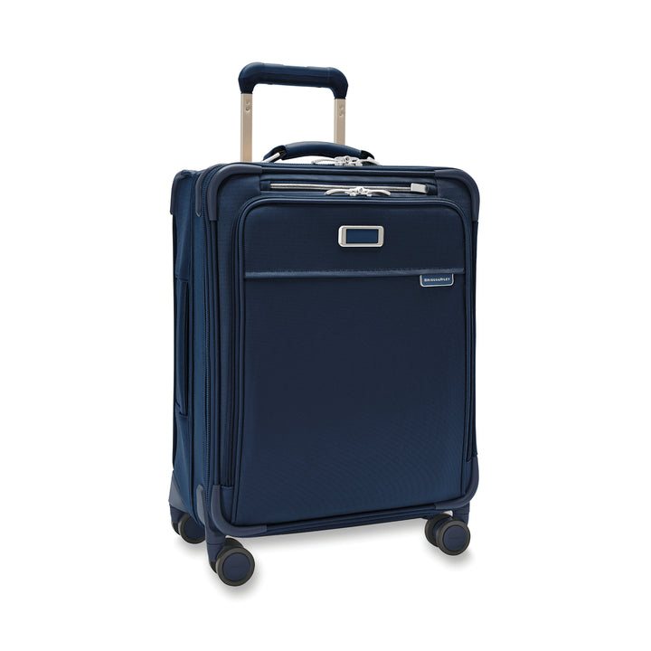 Intentional navy blue carry on suitcase has 4 spinning wheels