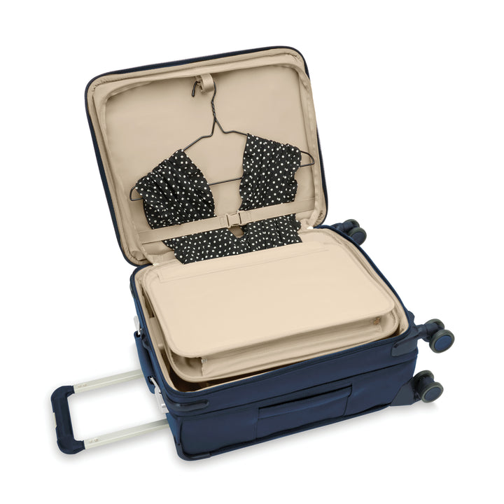 Briggs and Riley Global Carry on Spinner Interior has a tri fold built in folder to pack suits or dresses