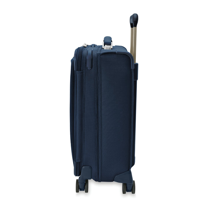 Side view of navy blue carry on compressed