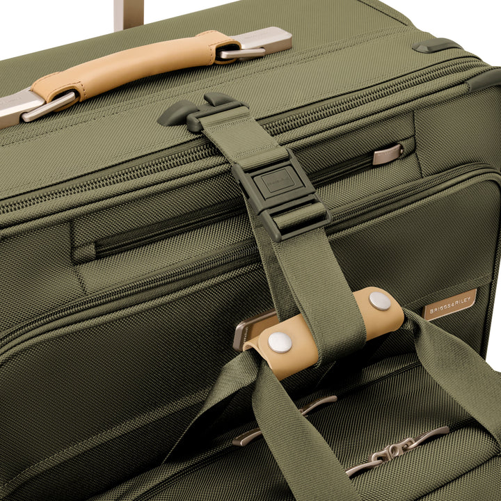 Additional Strap can attach duffel bag or tote to luggage while wheeling through airport