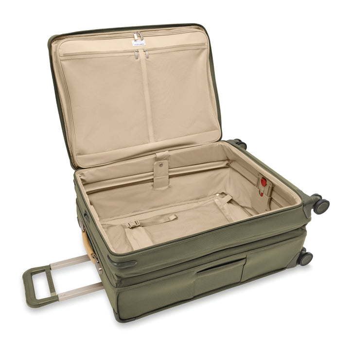 Interior of large expandable spinner has light tan lining to easily see items