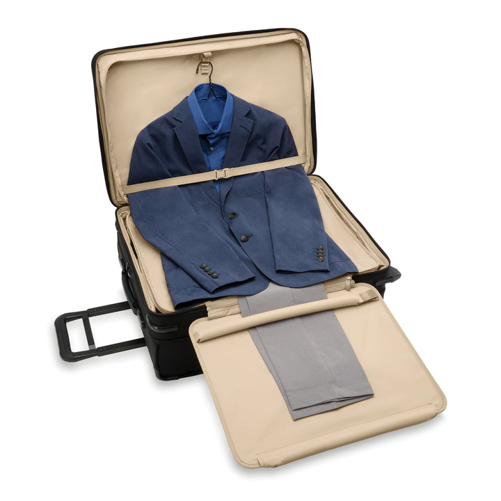 Inside of medium suitcase has suiter for packing a suit and dresses