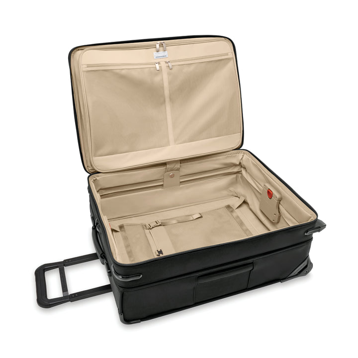 Inside lining of medium upright luggage is light tan so you can easily see items