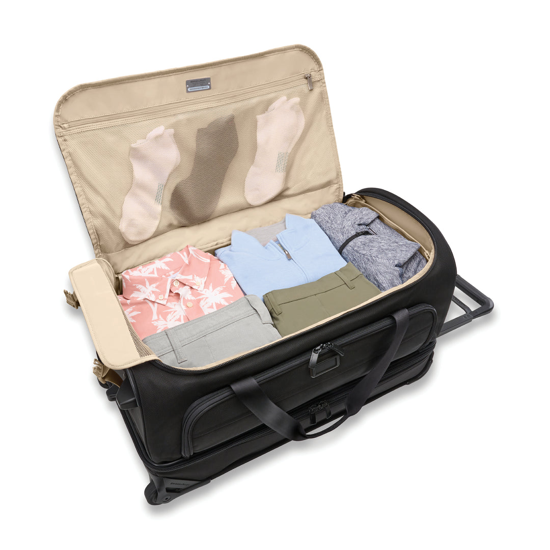 Medium duffel bag packed with shirts, pants and socks