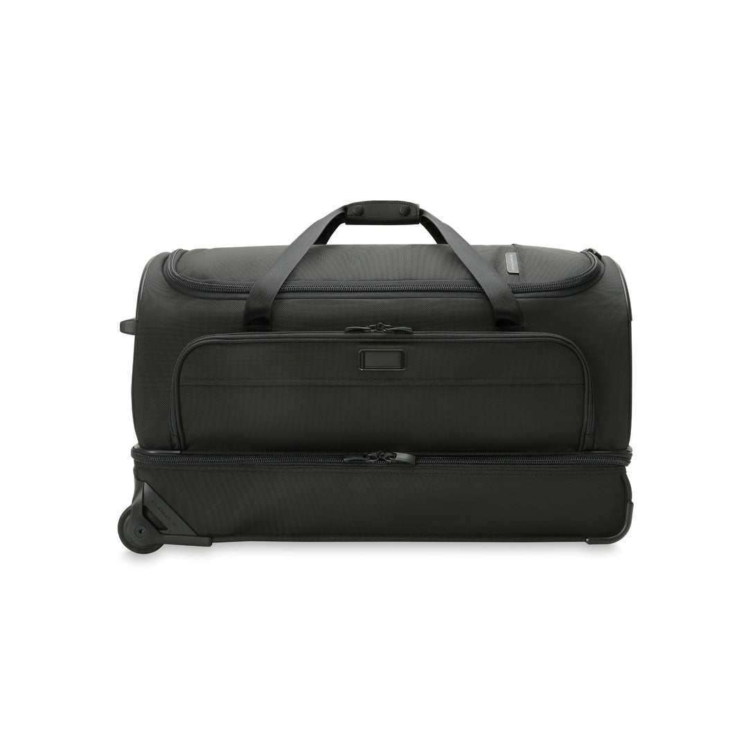 Medium Duffle Bag Shown on Floor with Side Carry Handle Option and leather touch point