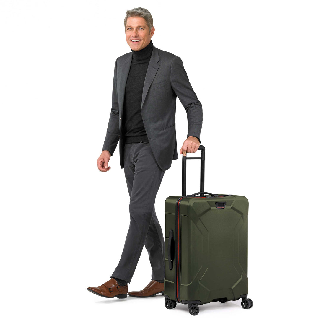 Briggs & Riley Torq Medium Spinner with male model in suit