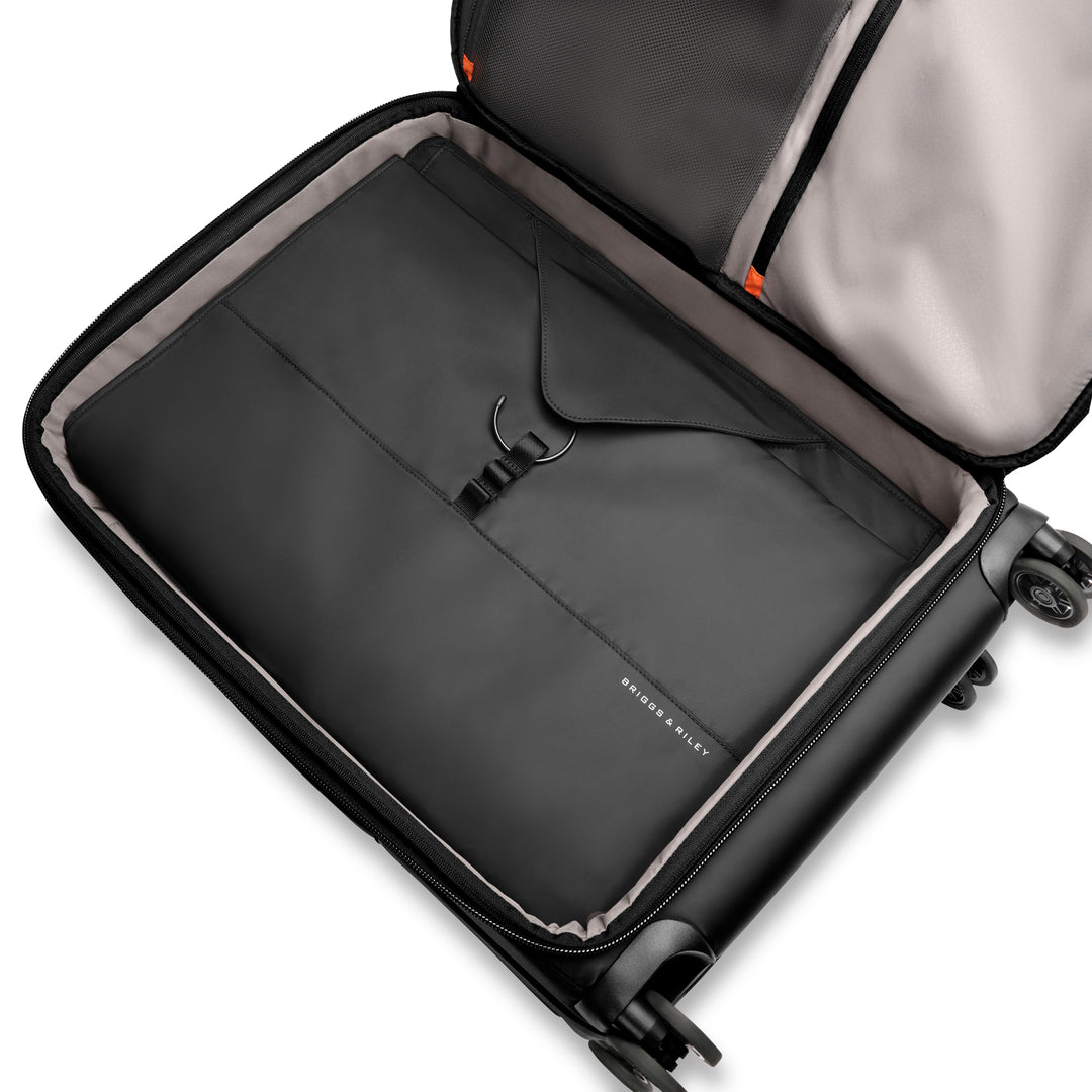 Garment sleeve packed in check in suitcase