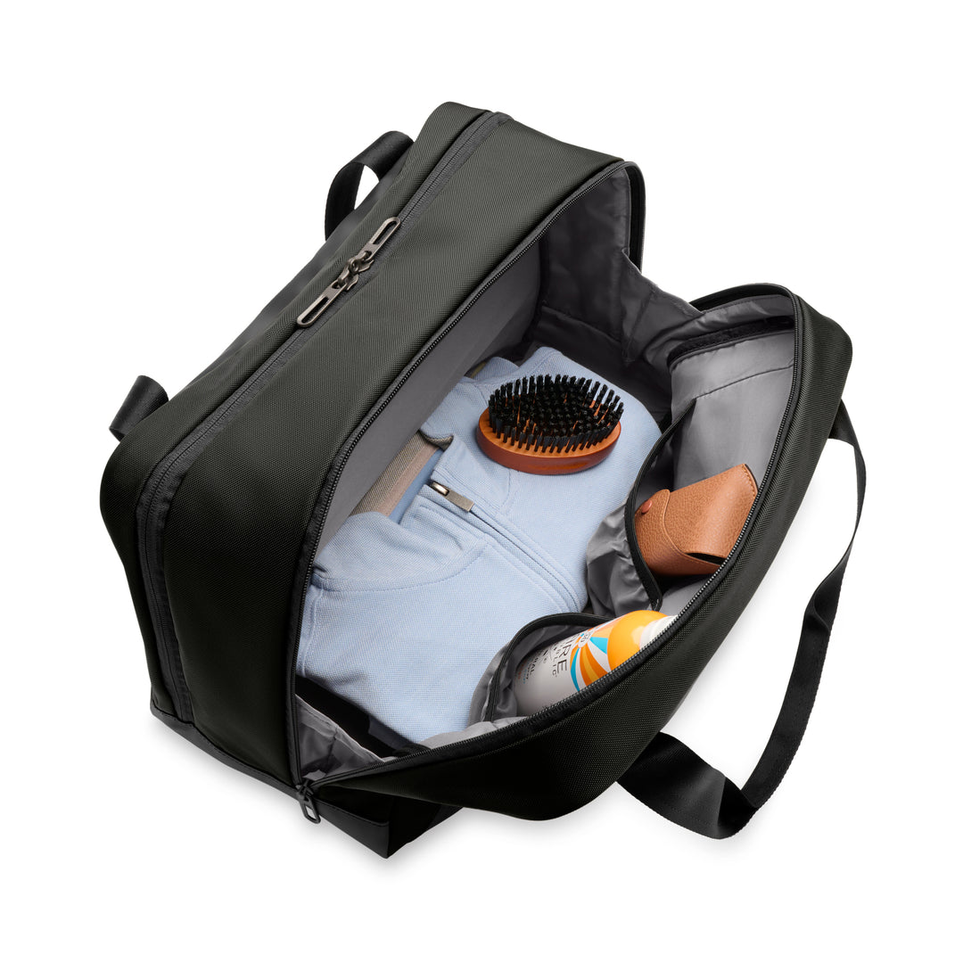 interior packed with blue sweatshirt brush glasses and sunscreen Briggs & Riley ZDX Underseat Cabin Bag