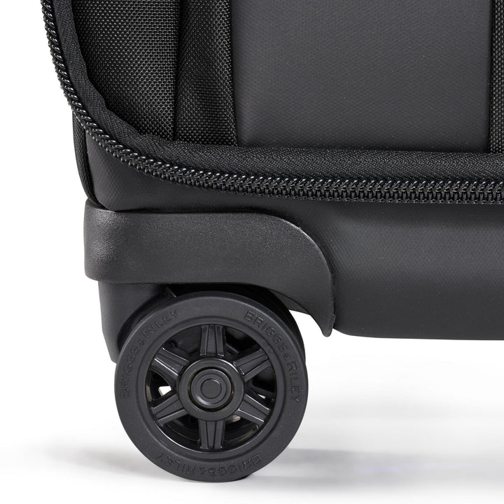 Briggs & Riley ZDX International 21" Carry-On Expandable Spinner closeup of 360 degree navigation wheels