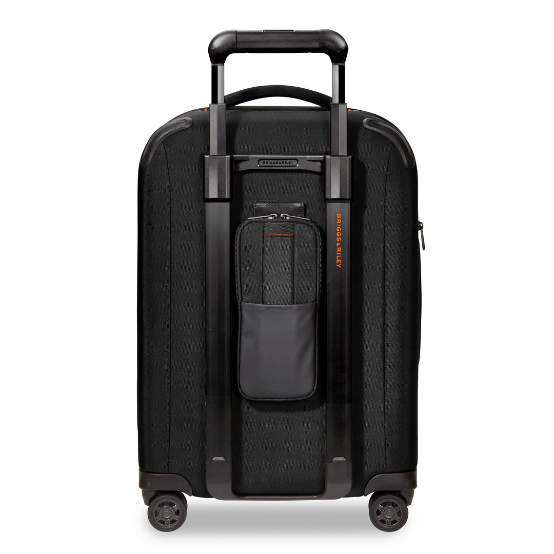 Back side of Briggs & Riley ZDX Domestic 22" Carry-On Expandable Spinner with power pocket to store battery pack to charge cell phone