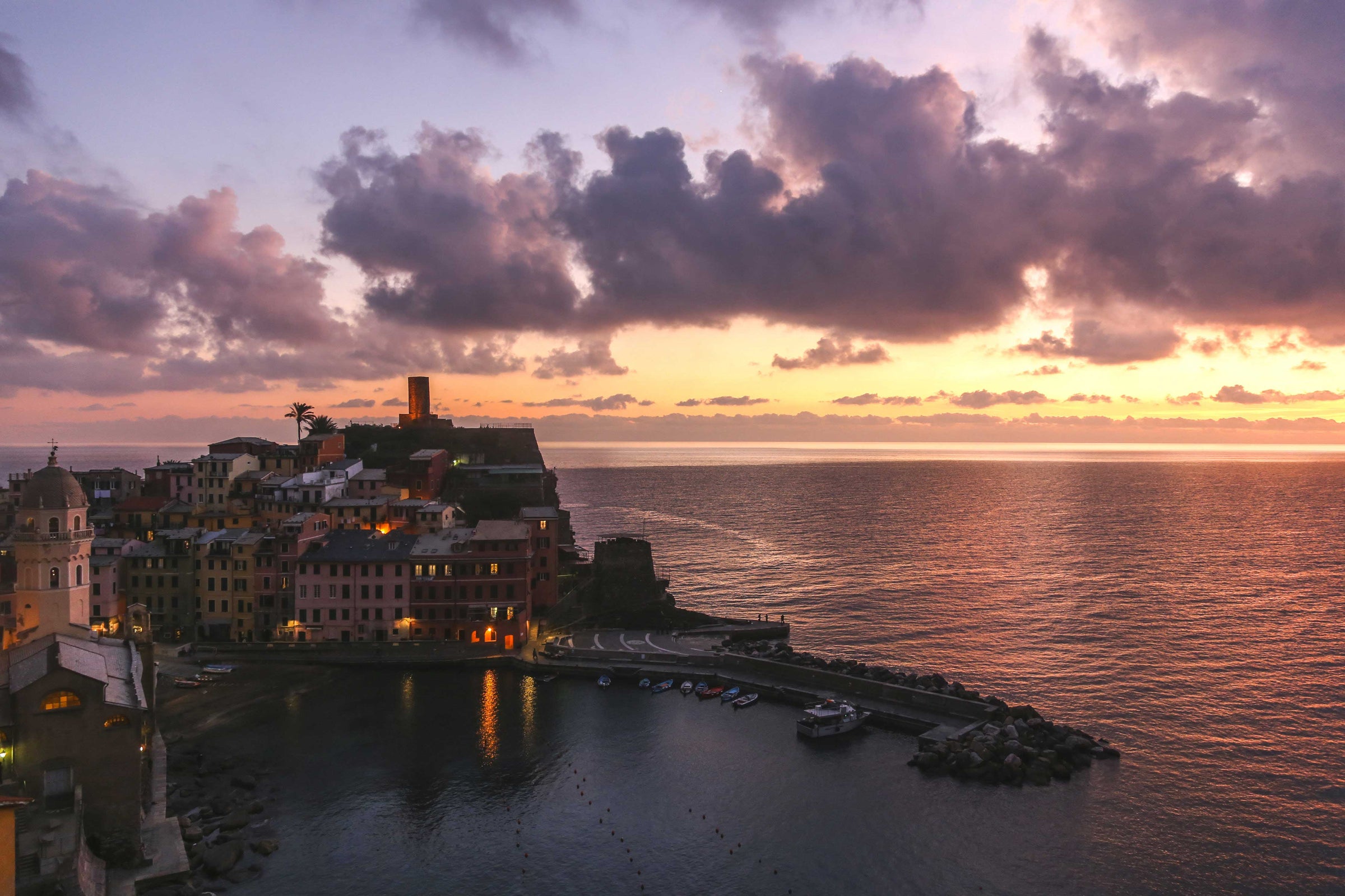 Photo of Vernazza Italy at sunset on water